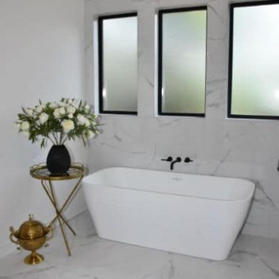 Freestanding tub with stunning tile work by Meyer Brant Custom Homes